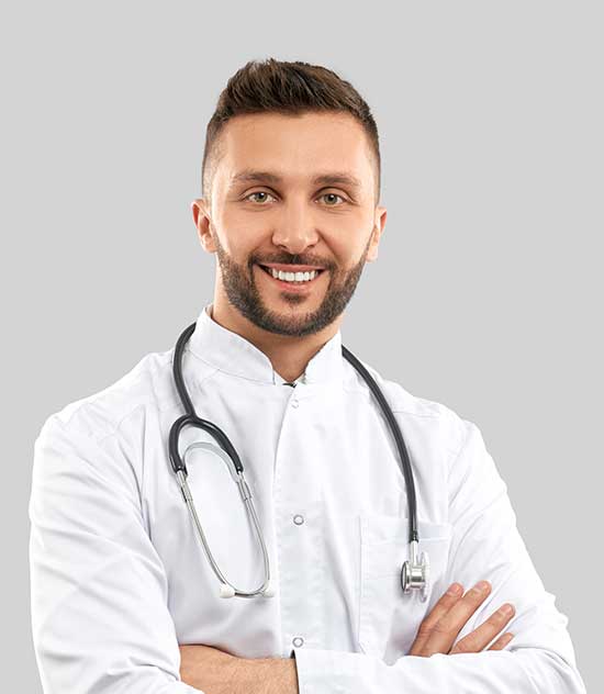 Male doctor in a white coat with a stethoscope, arms crossed, smiling at the camera